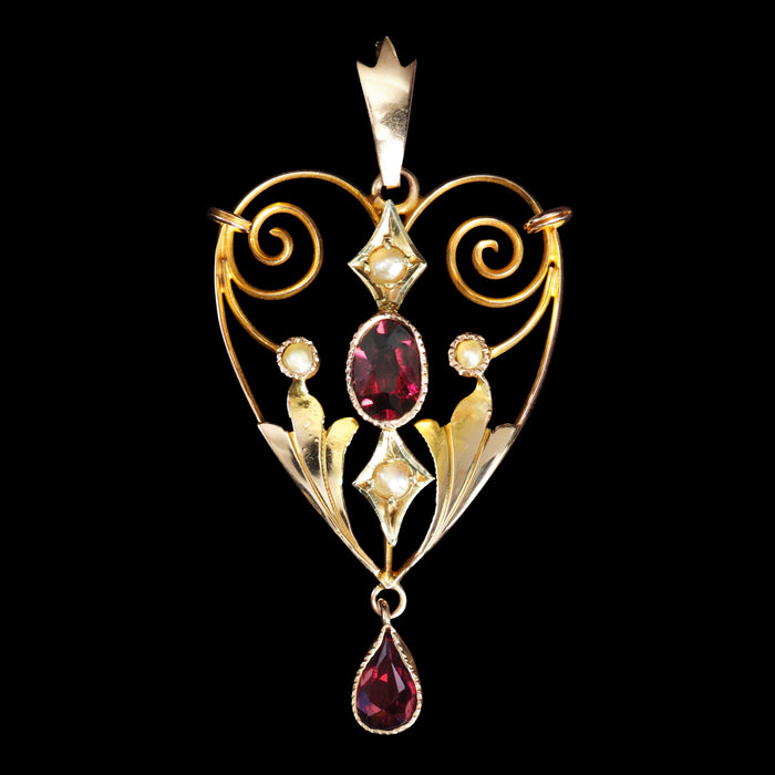 Front view of antique Art Nouveau pendant with garnets and seed pearls in 9ct gold
