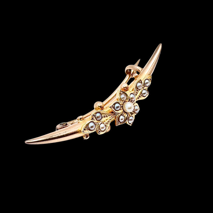 Antique Victorian 15ct gold split pearl crescent brooch with central flowerhead motif, circa 1880. 3/4