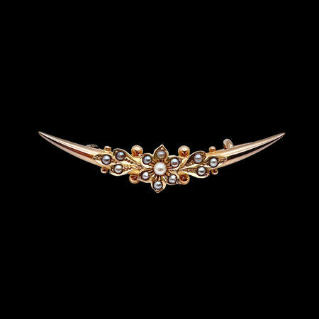 Antique Victorian 15ct gold split pearl crescent brooch with central flowerhead motif, circa 1880. Front