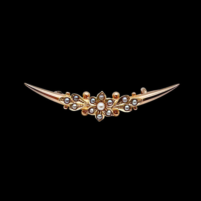 Antique Victorian 15ct gold split pearl crescent brooch with central flowerhead motif, circa 1880. Front