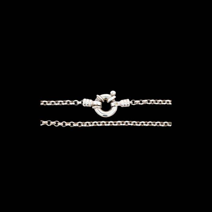 Vintage sterling silver belcher chain bracelet with bolt ring clasp, Edinburgh hallmark 1999, lion passant and maker’s mark LL visible, polished round links, classic minimalist British silver jewellery design. Clasp view