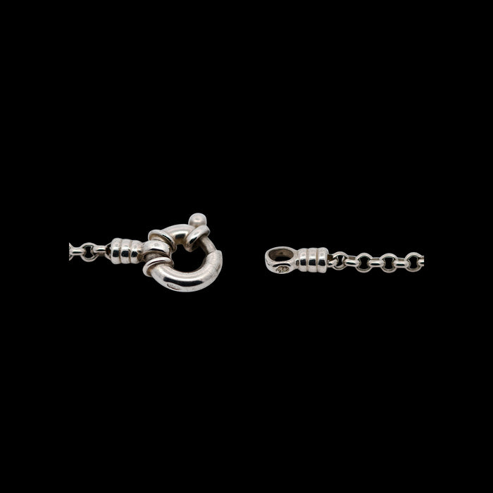 Vintage sterling silver belcher chain bracelet with bolt ring clasp, Edinburgh hallmark 1999, lion passant and maker’s mark LL visible, polished round links, classic minimalist British silver jewellery design. Clasp view